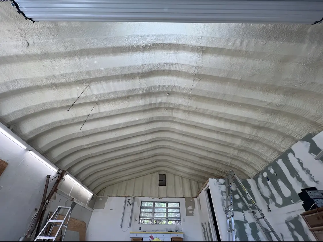 Spray polyurethane foam applied to the underside of a metal roof deck in Wade Hampton